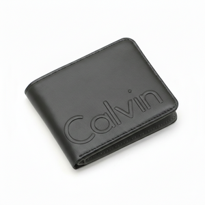 Straight-on front view of a Calvin Klein men's black leather bifold wallet displaying the prominent debossed Calvin lettering
