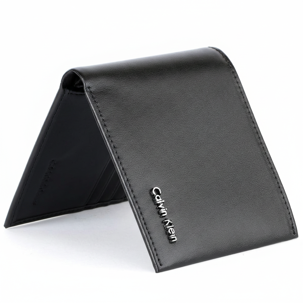 Straight-on front view of a closed Calvin Klein men's black smooth leather bifold wallet featuring a small silver metal logo hardware on the corner