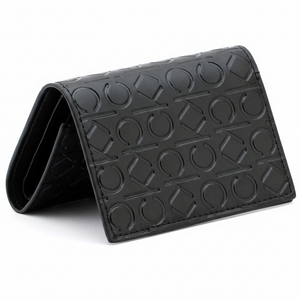 Perspective view of a standing semi-open Calvin Klein men's black leather wallet highlighting the continuous all-over embossed CK logo pattern across the exterior
