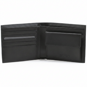 Fully open interior view of a Calvin Klein men's black leather wallet featuring card slots on the left, a snap-button coin pocket on the right, and debossed branding
