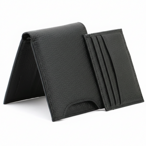 Angled view of a standing Calvin Klein men's black pebbled leather wallet with its matching removable card case partially pulled out from the front exterior slot