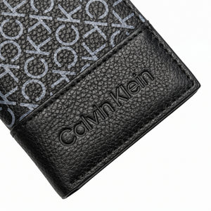Professional angled studio photograph of the sleek Calvin Klein mirror original grey printed monogram bi-fold leather wallet