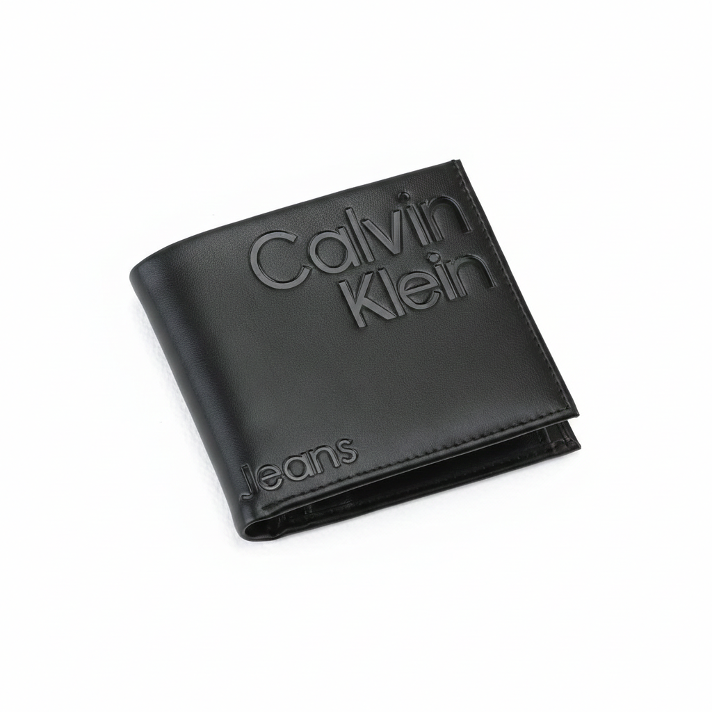 High-angle view of a closed Calvin Klein Jeans men's black genuine leather wallet showcasing the large debossed Calvin Klein logo and Jeans lettering on the front cover