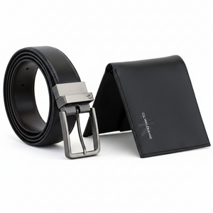 Top-down perspective of a Calvin Klein Jeans black leather wallet with a silver logo and a matching reversible leather belt with a gunmetal-toned pin buckle