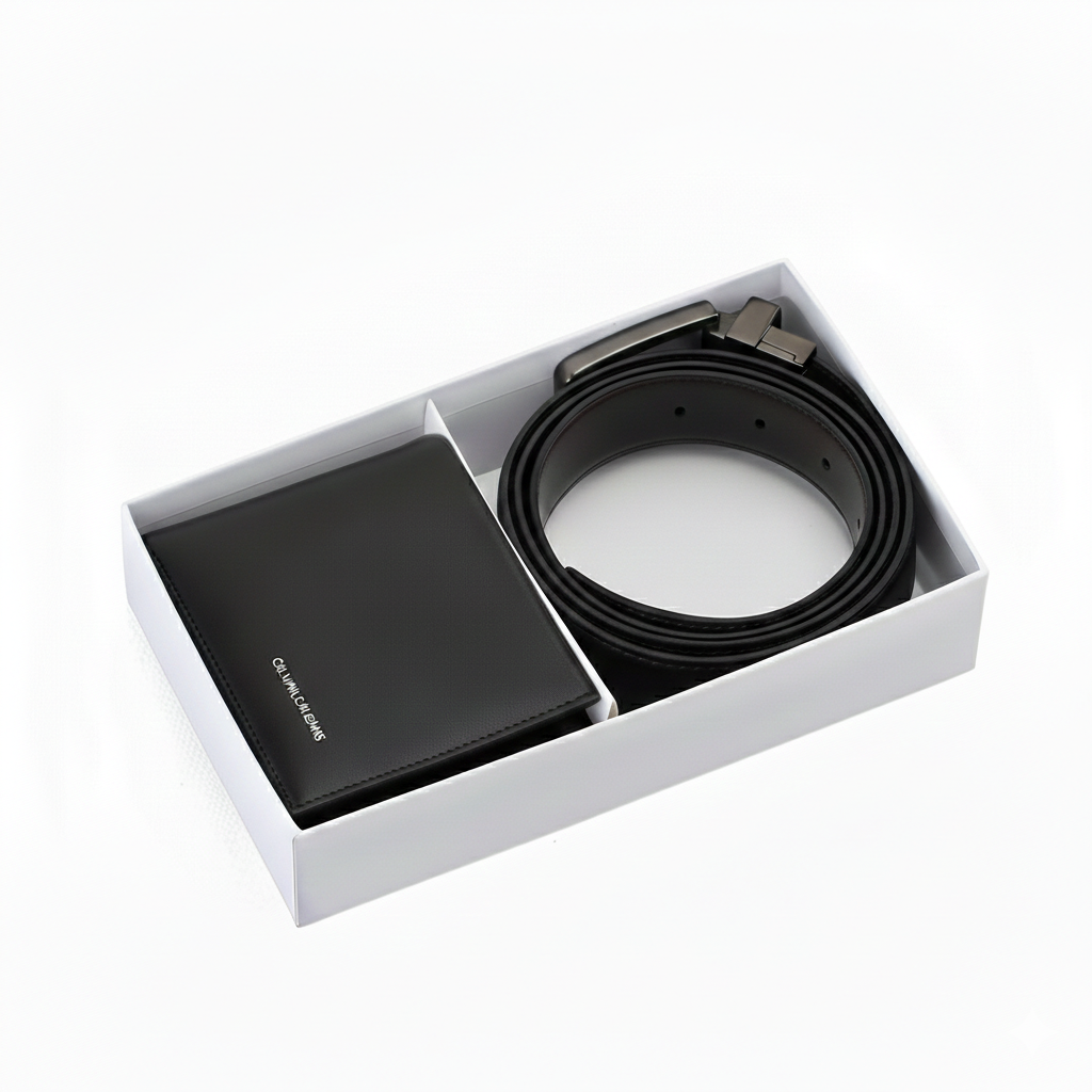 Calvin Klein Jeans men's accessory gift set featuring a black leather bifold wallet and a rolled reversible leather belt inside a premium white branded presentation box
