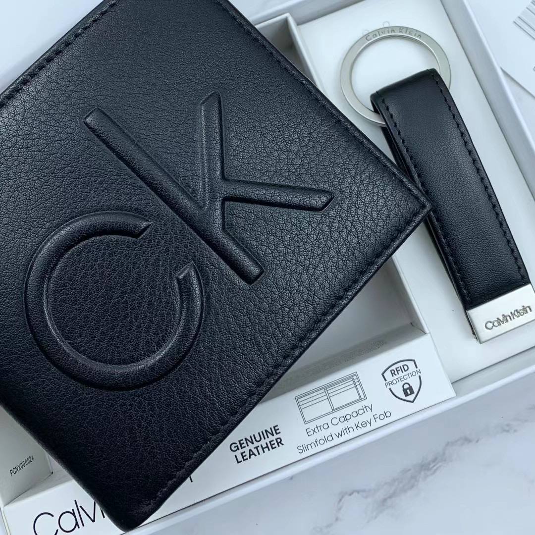 Close up of Large Embossed CK Logo on Black Pebbled Leather Wallet