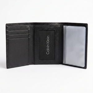 Internal layout view of the Calvin Klein monogram leather wallet showing multiple card slots and clear flip-up ID window