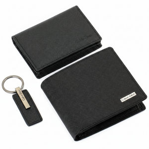 Detailed interior view of the Calvin Klein black saffiano leather bifold wallet and matching card holder, showing practical card slots and ID window