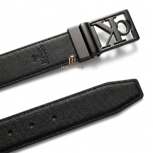 Detailed close-up of the Calvin Klein matte black plaque buckle showing the precision engraved brand logo