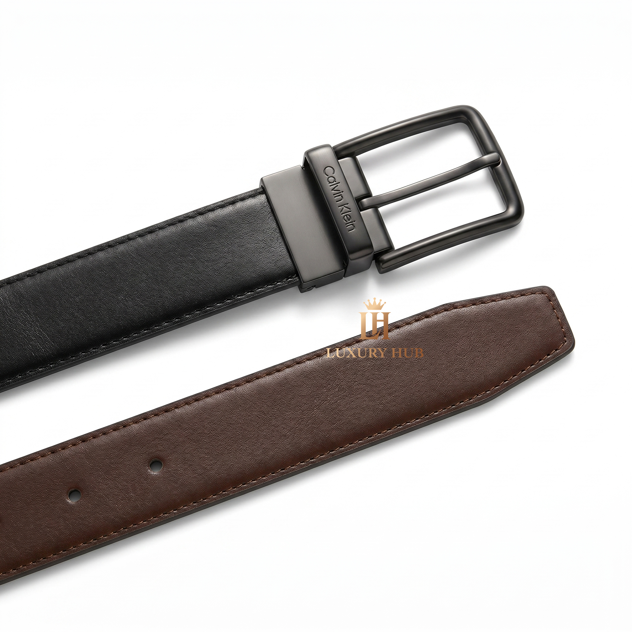Detailed close-up of the Calvin Klein matte black classic pin buckle showing the precision engraved brand logo