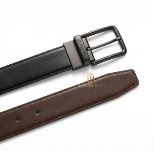 Detailed close-up of the Calvin Klein matte black classic pin buckle showing the precision engraved brand logo