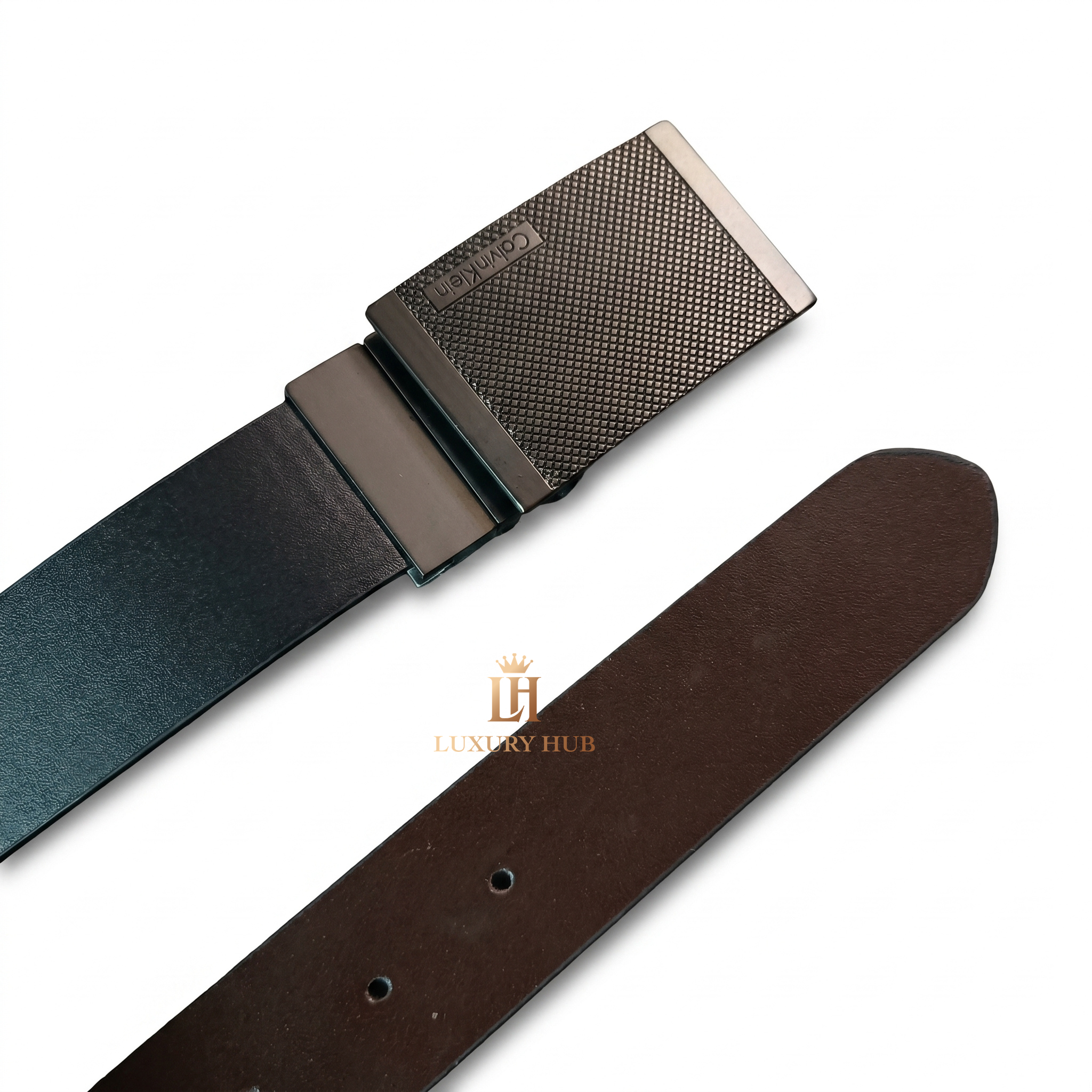 Detailed close-up of the Calvin Klein matte black plaque buckle showing the precision texture and engraved logo