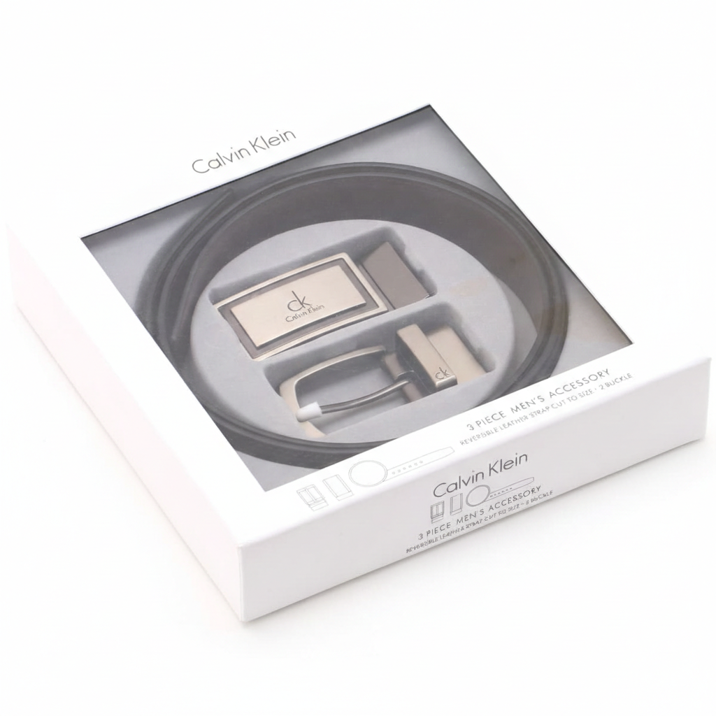 Luxury Calvin Klein men's 3-piece accessory gift set showcasing a black leather belt and two interchangeable buckles inside a premium branded window box