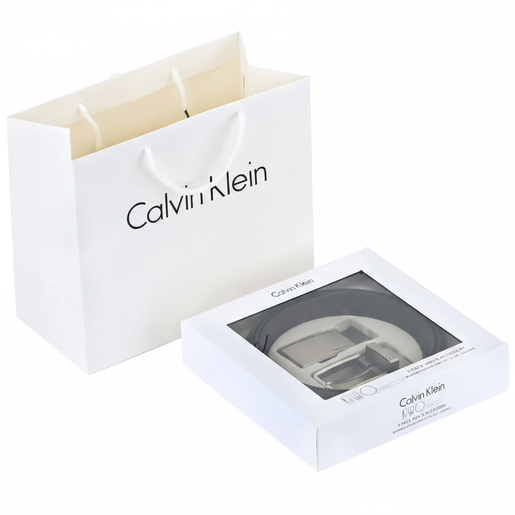 Premium Calvin Klein men's gift set featuring a double-face leather belt and two buckles, presented in a luxury white branded box with a matching shopping bag