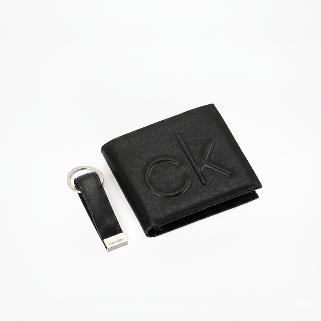 Top-down view of a premium Calvin Klein men's gift set featuring a black leather bifold wallet with a large debossed cK monogram and a matching leather keychain
