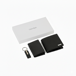 Premium Calvin Klein men's gift set including a black saffiano leather bifold wallet, a matching card holder, and a leather keychain, presented with a luxury white branded gift box