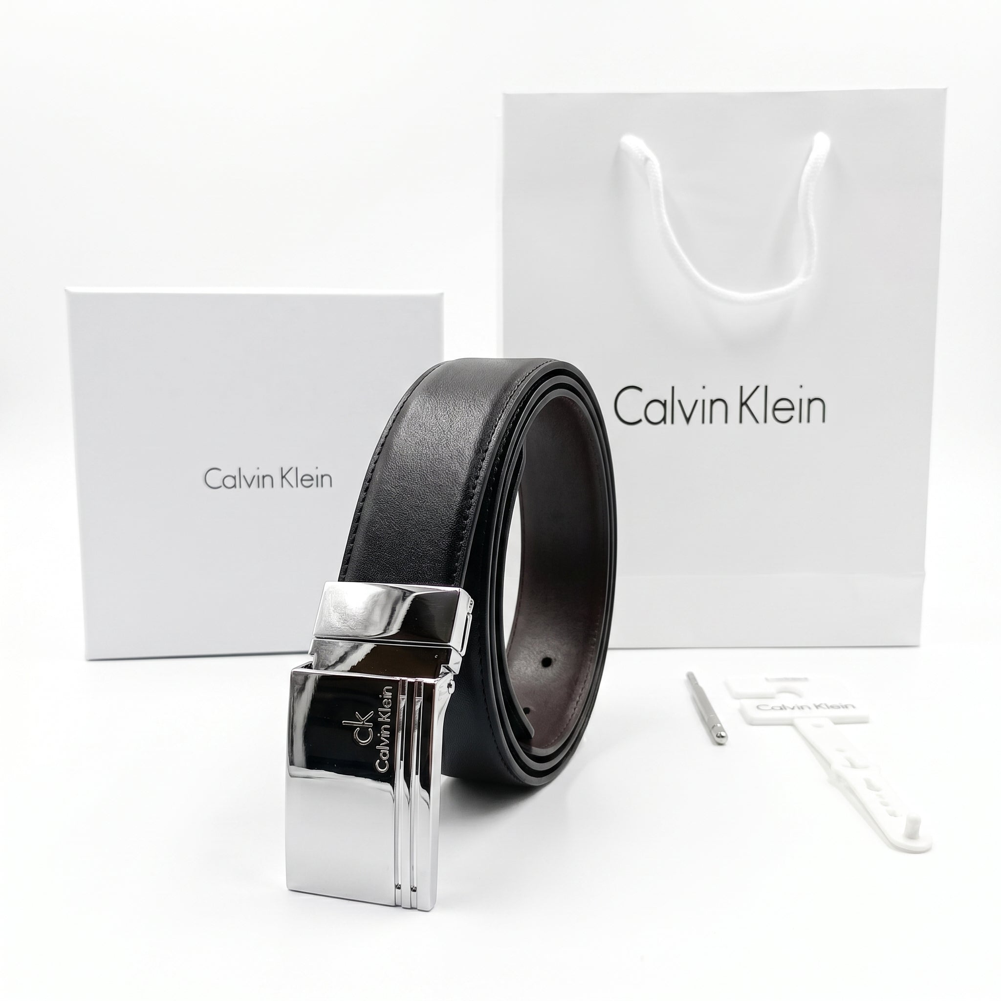 Premium Calvin Klein mirror original reversible belt set with polished silver buckle, luxury white gift box, and branded shopping bag
