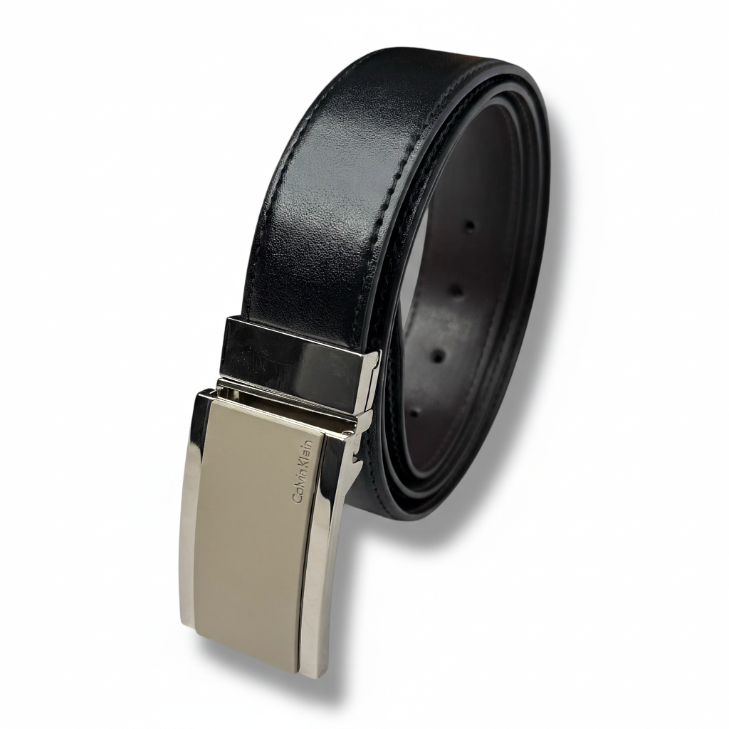 Rolled Calvin Klein men's belt showing textured black side and smooth brown reverse side