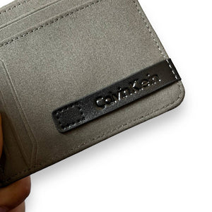 Interior view of an open black Calvin Klein men's bifold wallet showing multiple card slots.