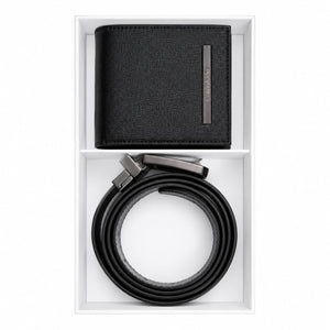 Live smartphone photograph of the Calvin Klein mirror original 2-piece gift set showcasing the black leather wallet with round silver logo and rolled reversible belt inside the custom white box