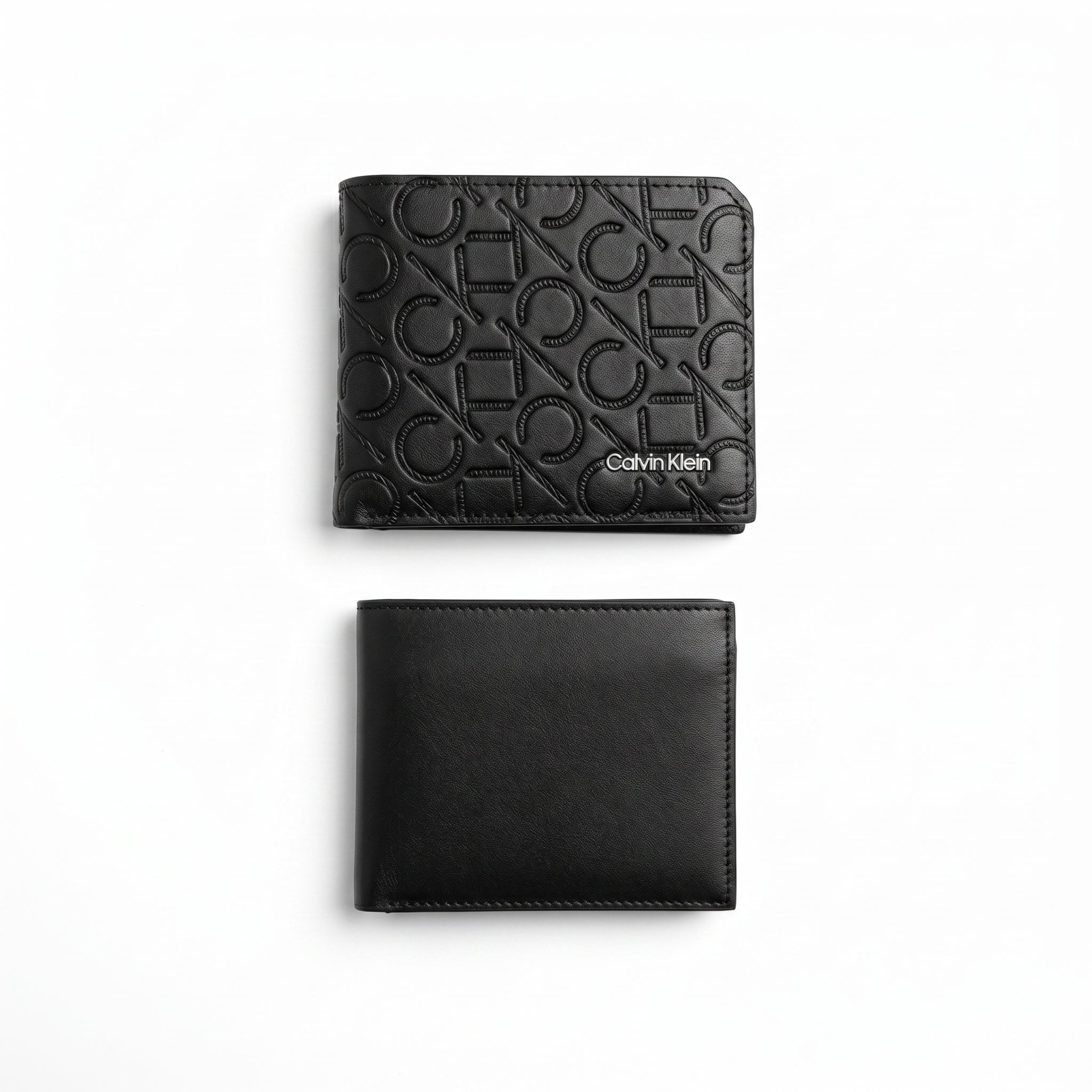 Studio product view of the Calvin Klein mirror original smooth black leather bifold wallet next to its matching standalone minimalist card holder