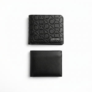 Studio product view of the Calvin Klein mirror original smooth black leather bifold wallet next to its matching standalone minimalist card holder