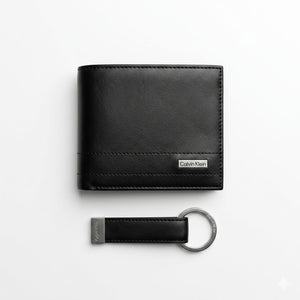 Studio product view of the Calvin Klein mirror original smooth black leather bifold wallet next to its matching standalone premium leather keychain