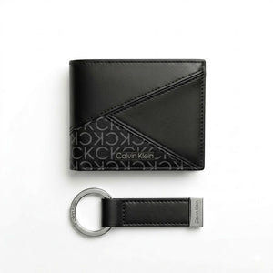 Straight studio layout view of the Calvin Klein mirror original black smooth leather wallet front panels alongside its matching standalone luxury keychain