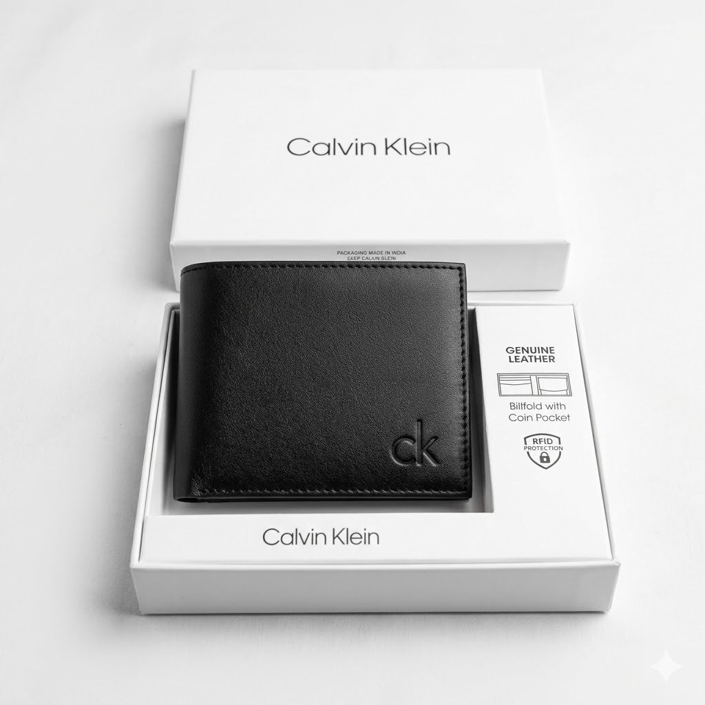 Top-down studio product photography of the Calvin Klein mirror original smooth black leather wallet neatly resting inside its open custom white branded gift box