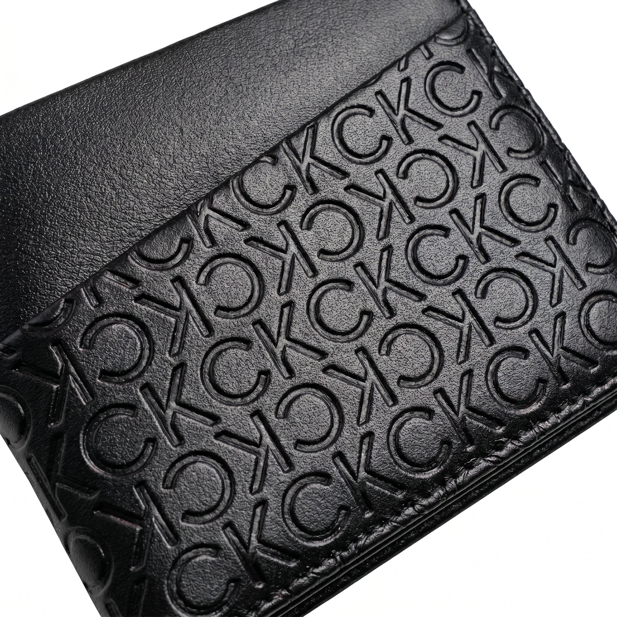 Professional angled studio photograph of the sleek Calvin Klein mirror original black leather wallet showcasing the geometric front panels and small silver logo plate