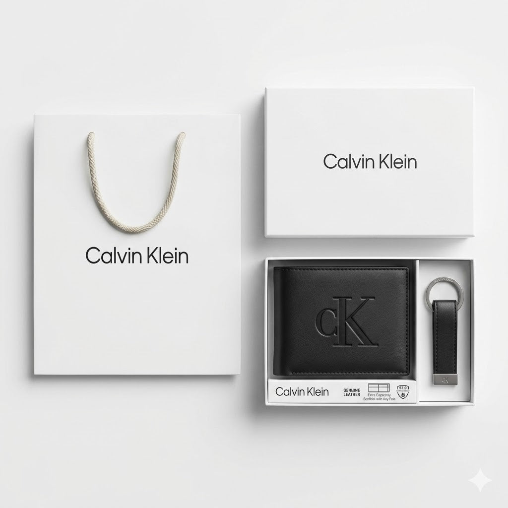 Full premium packaging presentation of the Calvin Klein mirror original smooth black leather bifold wallet and keychain set with its white gift box and matching shopping bag