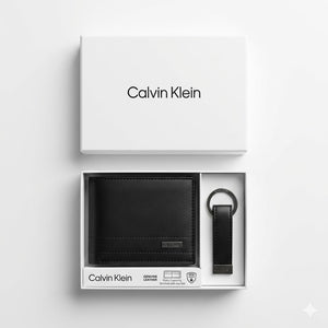 Top-down studio product photography of the Calvin Klein mirror original smooth black leather wallet and keychain set neatly resting inside its open white branded gift box
