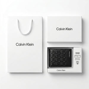 Full premium packaging presentation of the Calvin Klein mirror original monogram and smooth black leather bifold wallet with its white gift box and matching shopping bag