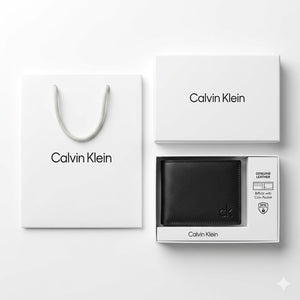 Full premium packaging presentation of the Calvin Klein mirror original monogram and smooth black leather bifold wallet alongside its white gift box and matching shopping bag