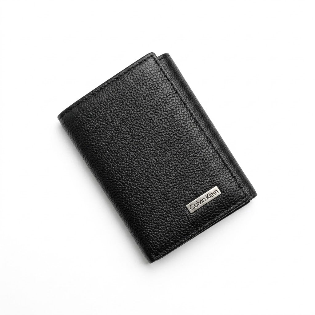 Black leather wallet with Calvin Klein logo on a white background