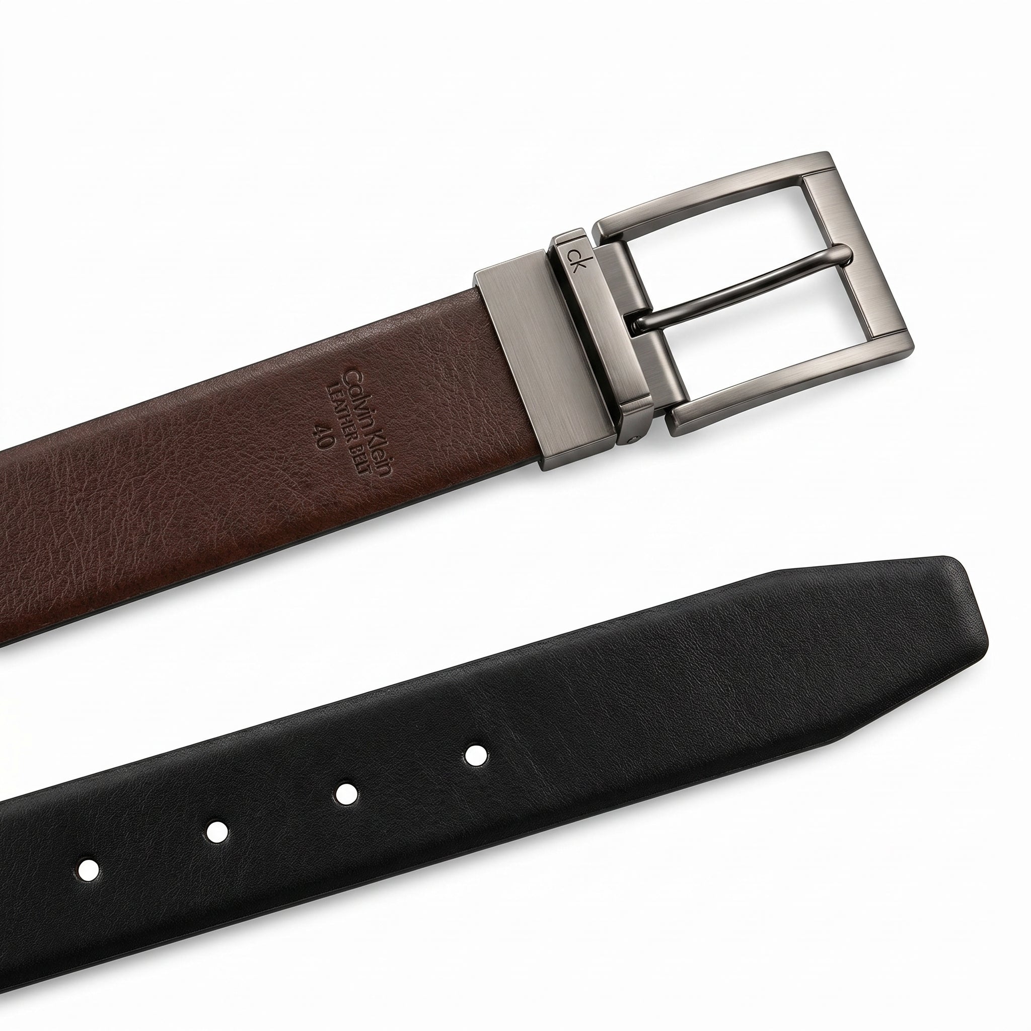 Detailed product presentation of the Calvin Klein mirror original reversible belt brown leather side showcasing the hot-stamped brand logo name and size 40