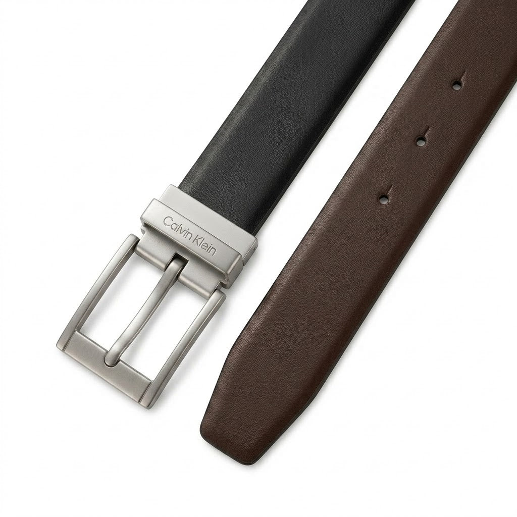Live smartphone photograph showcasing the brown leather side of the Calvin Klein mirror original reversible belt with its hot-stamped brand logo name and size 46