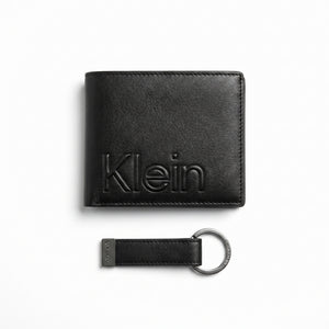 Professional angled studio photograph of the Calvin Klein mirror original smooth black leather wallet back panel showing the debossed Klein text logo