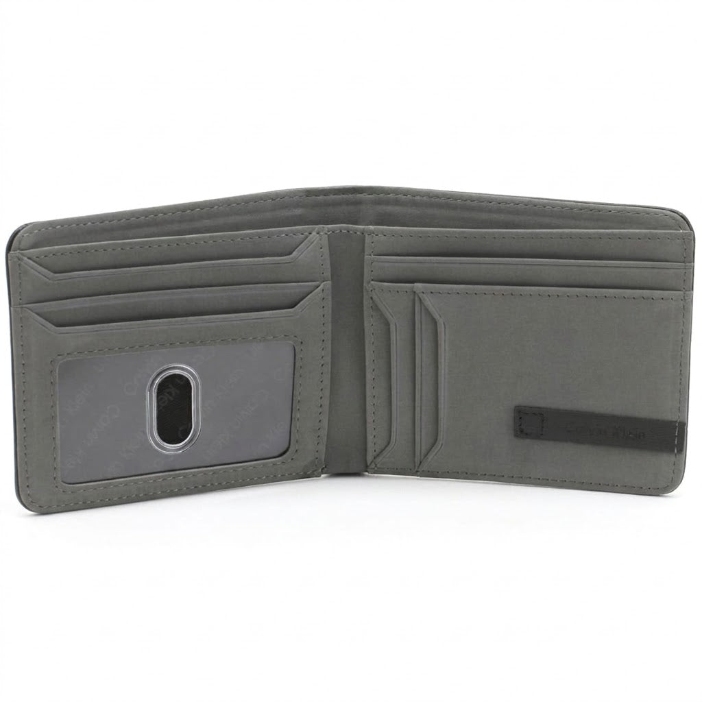 Internal layout view of the opened Calvin Klein mirror original leather bifold wallet showcasing the contrasting grey leather interior style, card slots, and clear ID window