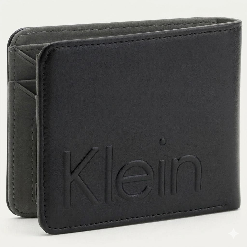 Straight studio view of the Calvin Klein mirror original black leather wallet back panel showing the debossed Klein text logo alongside the standalone matching keychain