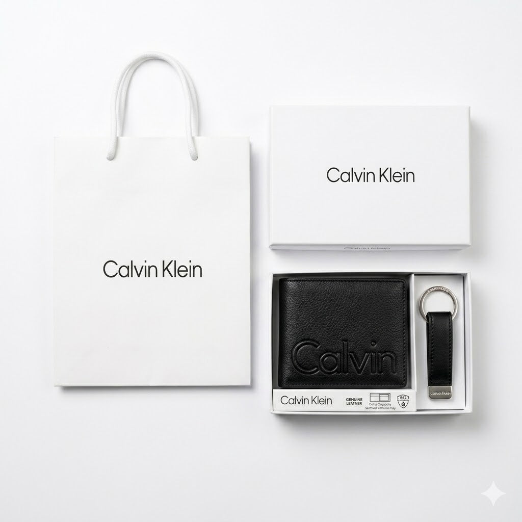 Full premium packaging presentation of the Calvin Klein mirror original smooth black leather bifold wallet and keychain set with its white gift box and matching shopping bag