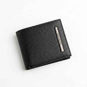 Professional angled studio photograph of the sleek Calvin Klein mirror original black textured leather bifold wallet standing on a clean background