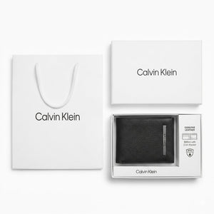 Full luxury presentation of the Calvin Klein mirror original black textured leather bifold wallet with its branded white gift box and matching shopping bag