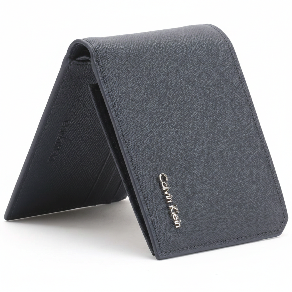 Straight-on front view of a slightly open Calvin Klein men's navy blue saffiano leather wallet displaying the elegant silver metal Calvin Klein logo