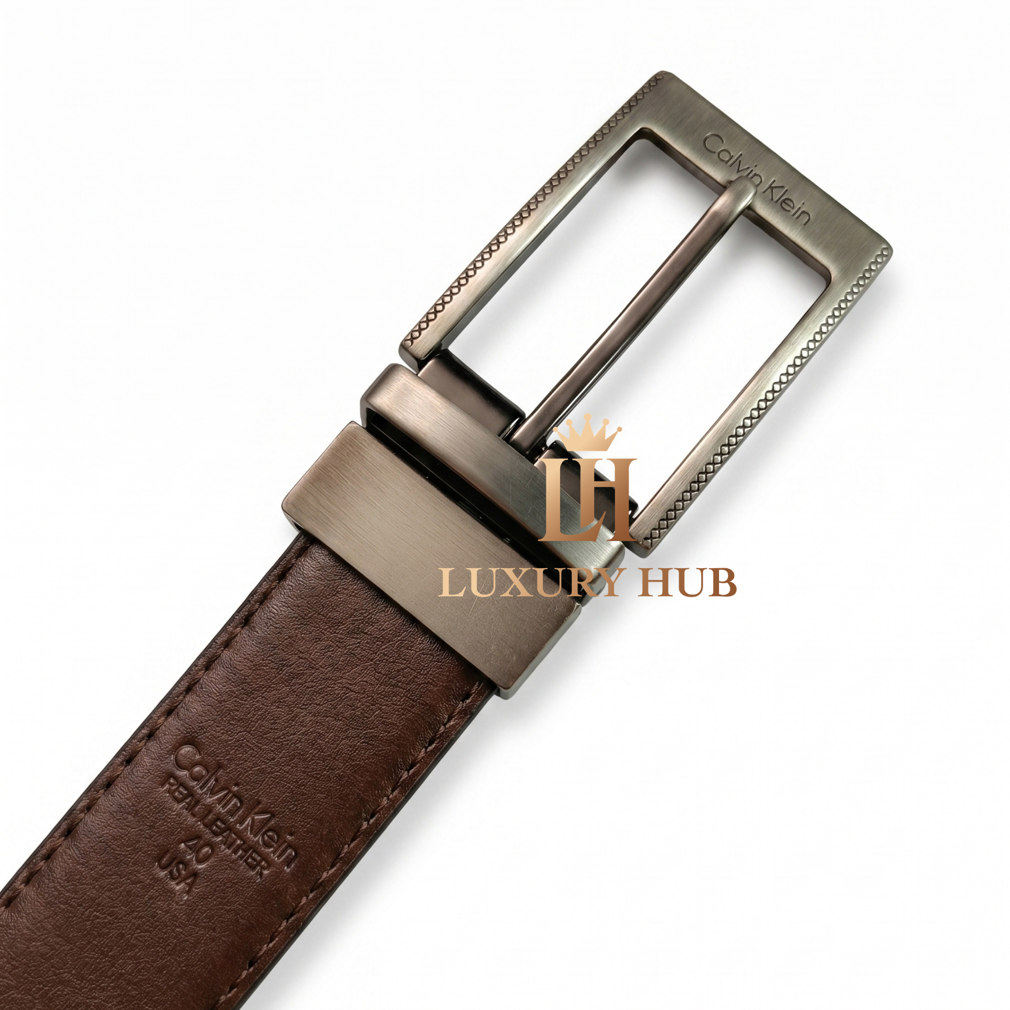 Detailed close-up of the Calvin Klein brushed metal buckle with precision-engraved brand logo