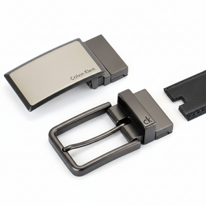 Detail shot of the Calvin Klein men's gift set showing the black leather side of the reversible belt with its two interchangeable metal buckles