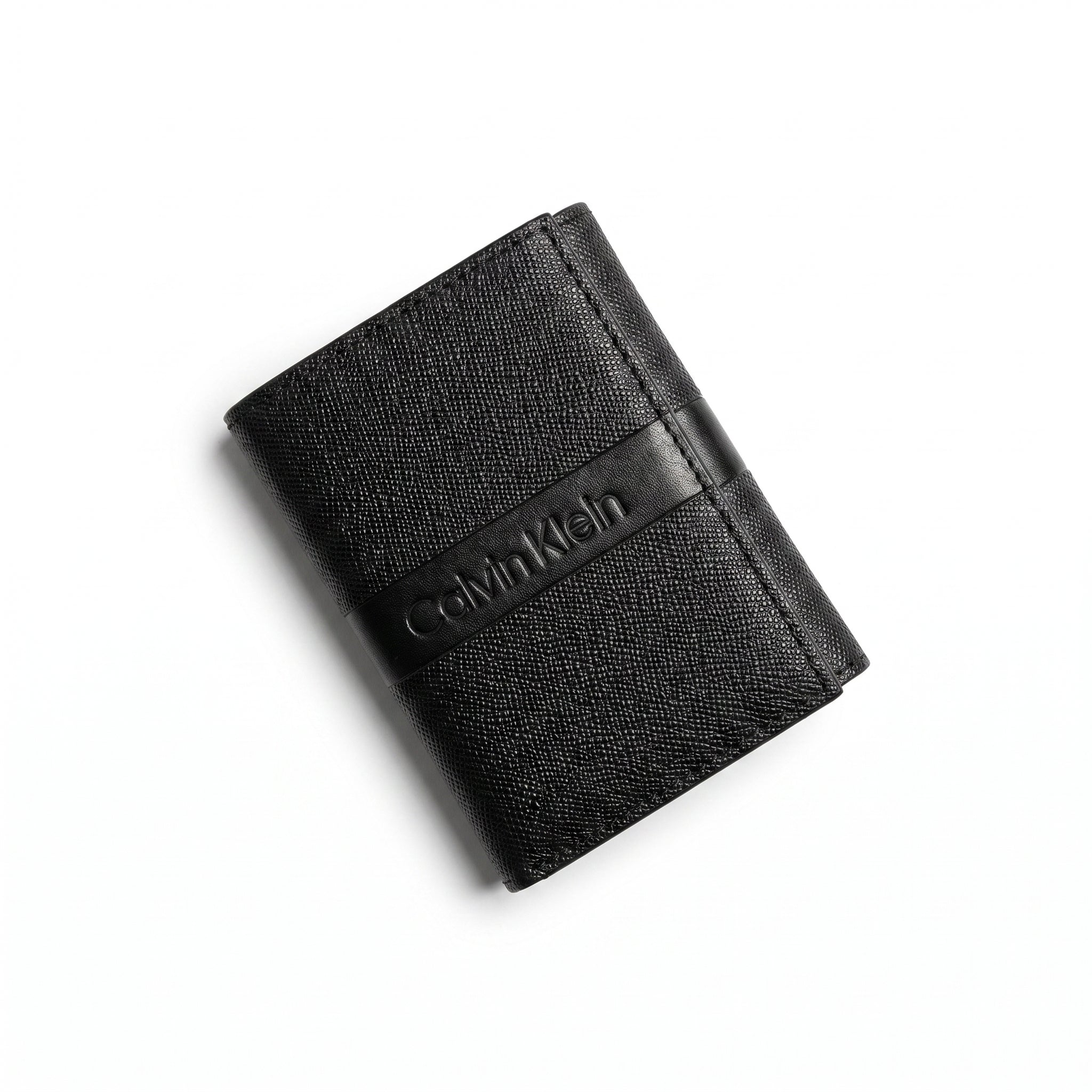 Professional angled studio photograph of the sleek Calvin Klein mirror original saffiano bi-fold leather wallet