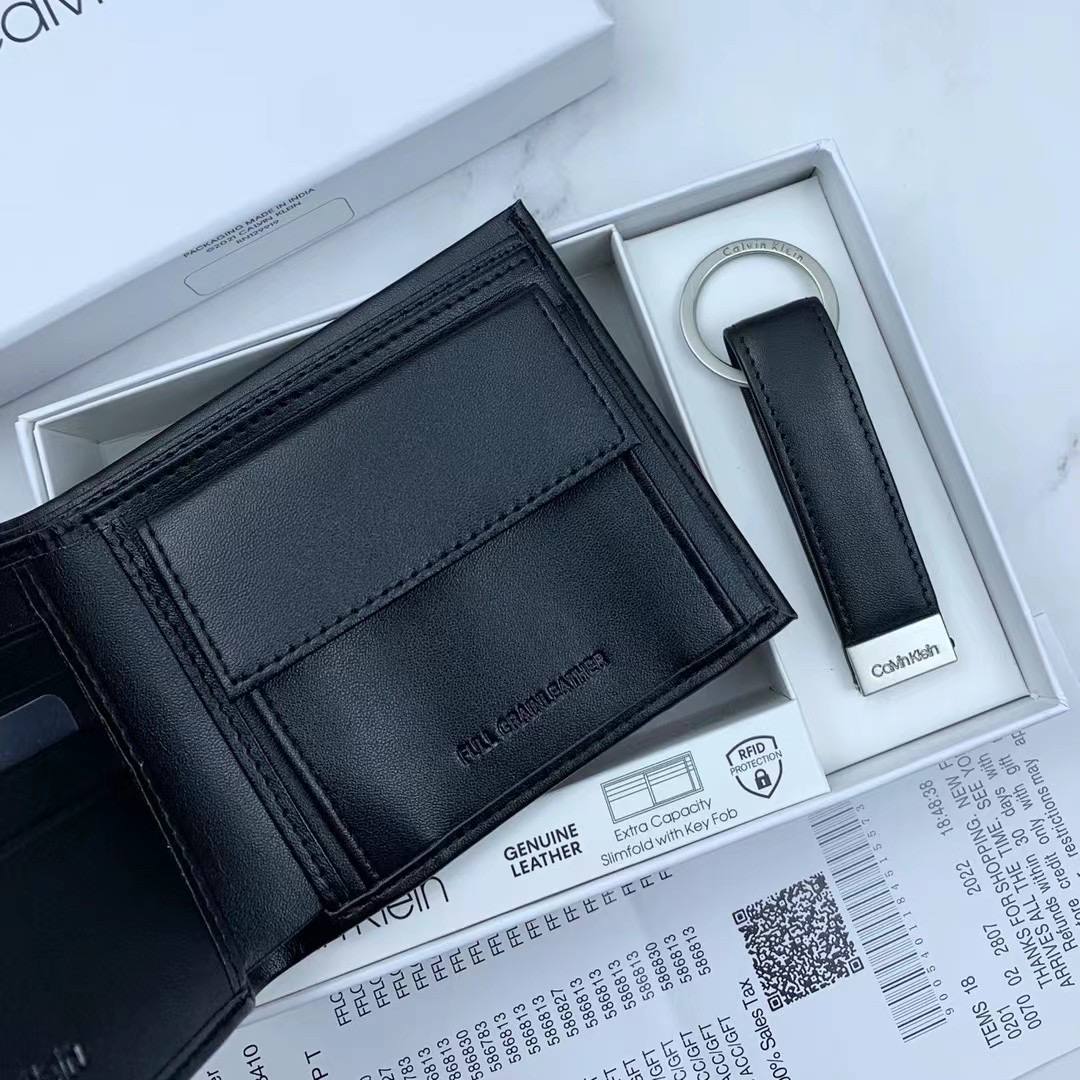Full interior layout of Calvin Klein wallet with coin pocket on right and slots on left