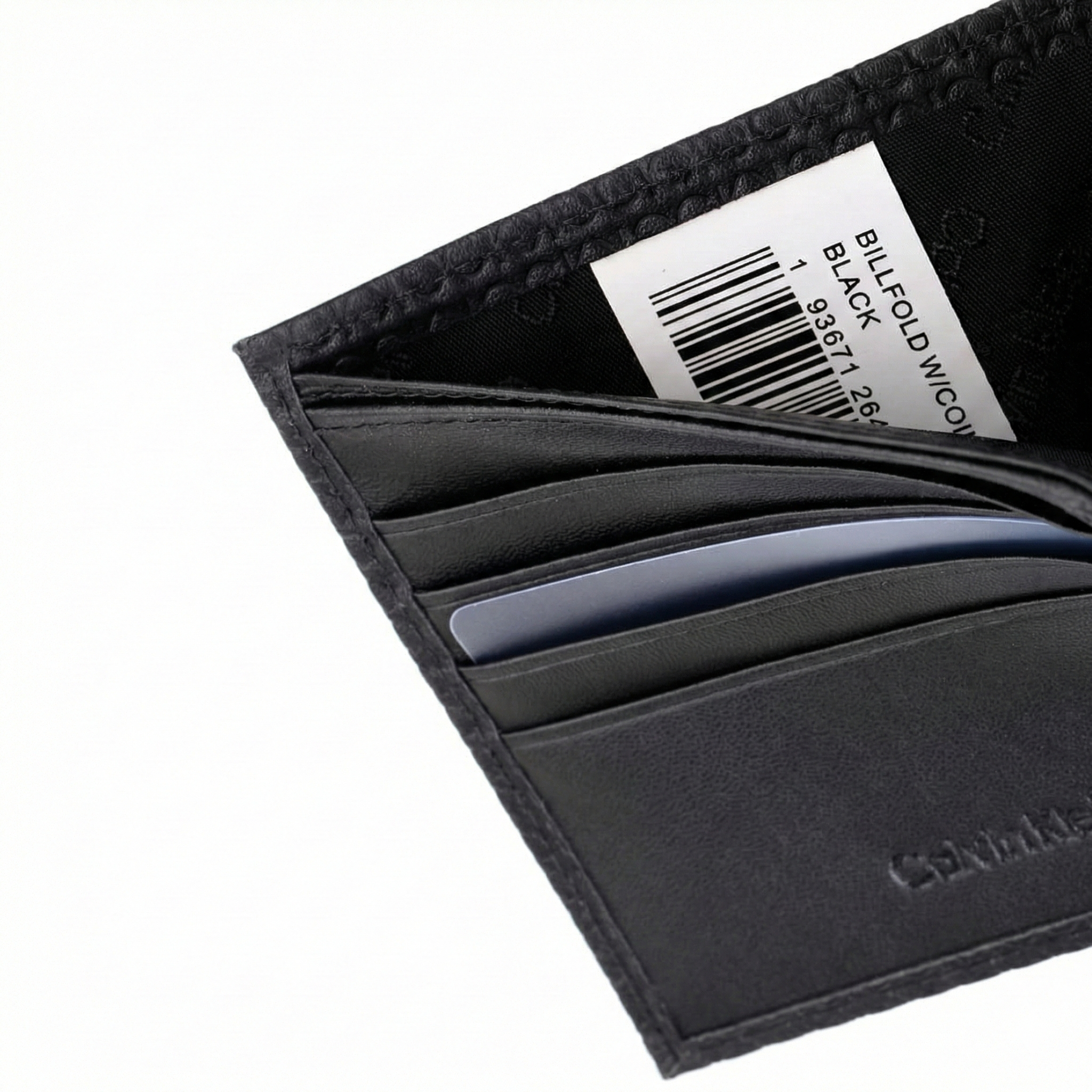 Interior detail of card pockets and logo in Calvin Klein black leather wallet