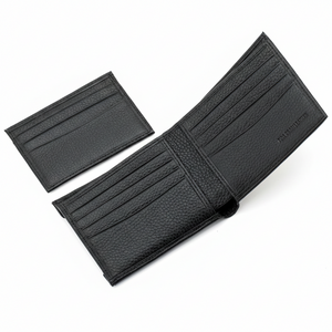 Angled interior view of an open Calvin Klein men's black wallet showing card slots and full grain leather debossing, next to its removable cardholder